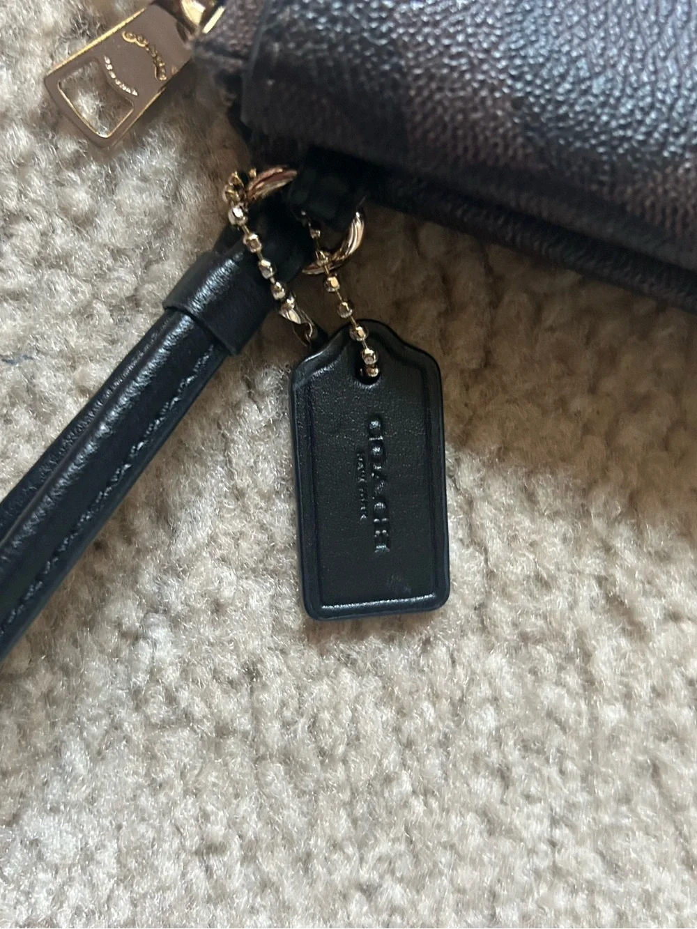 Coach Monogram Double Zip Wristlet in Brown and Black with Gold Hardware. F16109